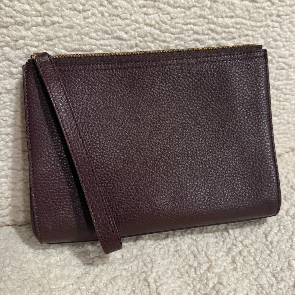Cuyana leather clutch in plum color